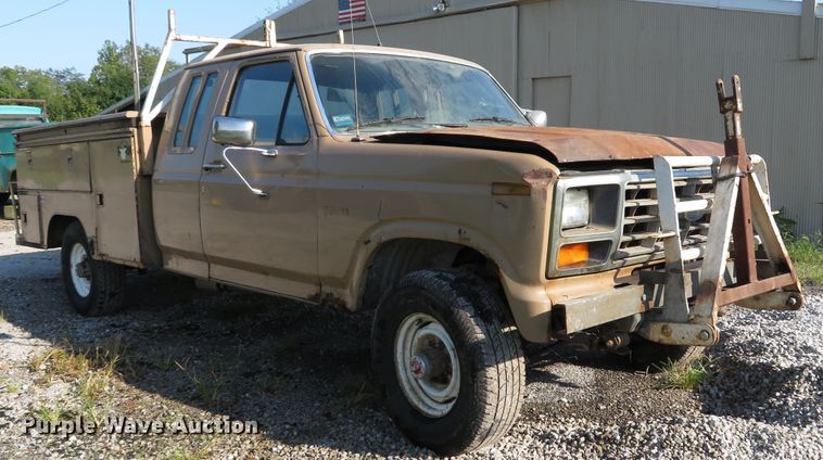 image for item DH1557 1984 Ford F250 Ext. Cab utility bed pickup truck