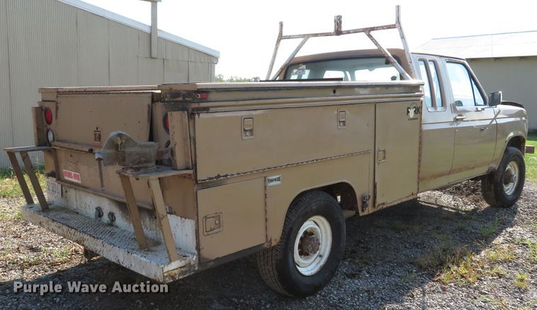 image for item DH1557 1984 Ford F250 Ext. Cab utility bed pickup truck
