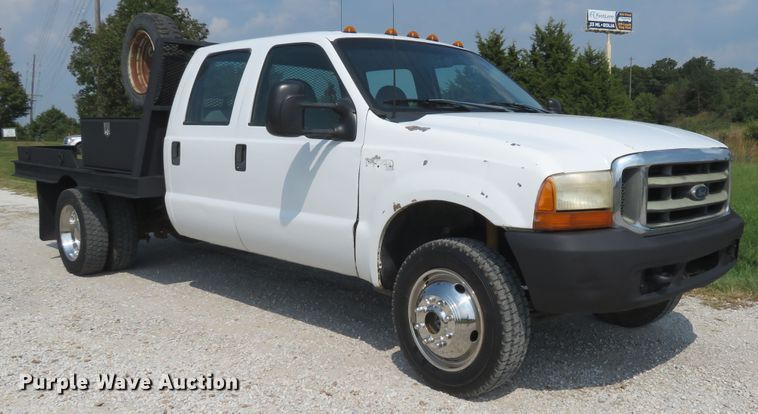 image for item DH1588 1999 Ford F550 Super Duty Crew Cab flatbed truck