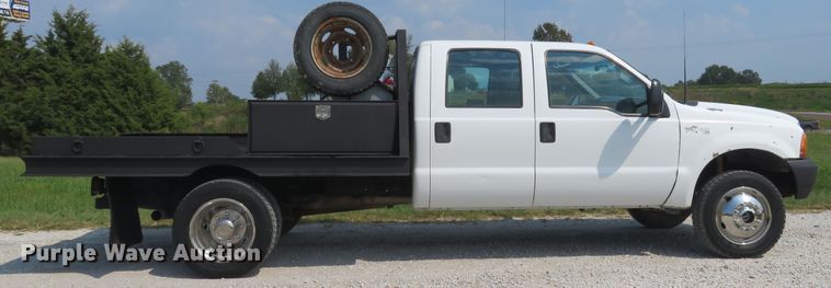 image for item DH1588 1999 Ford F550 Super Duty Crew Cab flatbed truck