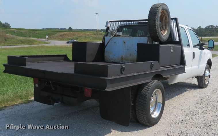 image for item DH1588 1999 Ford F550 Super Duty Crew Cab flatbed truck