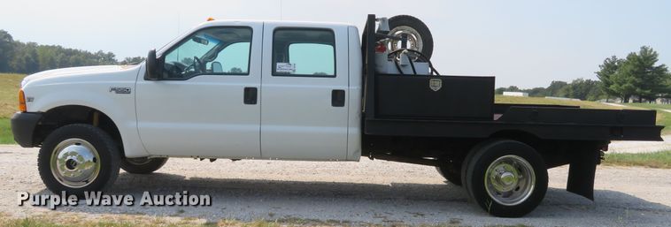 image for item DH1588 1999 Ford F550 Super Duty Crew Cab flatbed truck