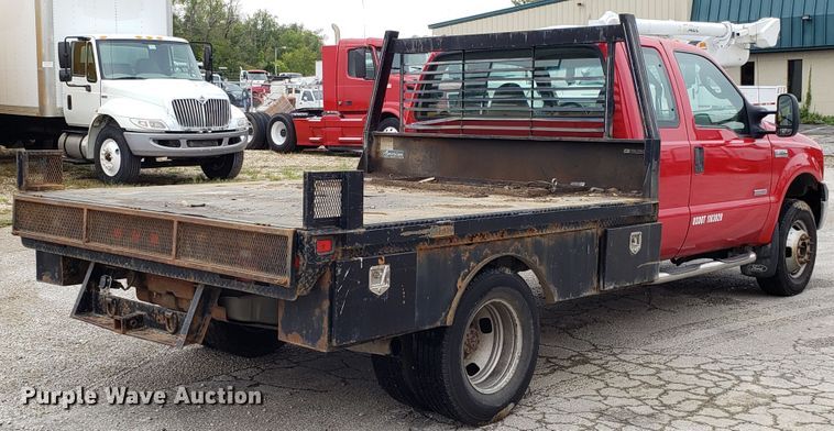 image for item DH2855 2006 Ford F350 Super Duty SuperCab flatbed pickup truck