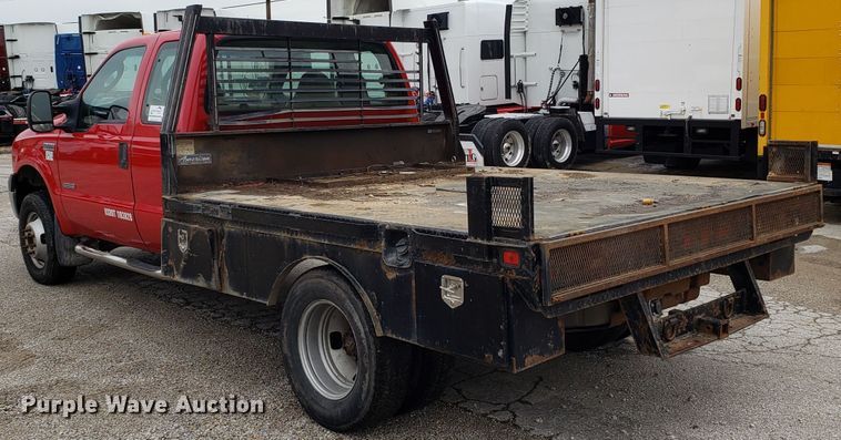 image for item DH2855 2006 Ford F350 Super Duty SuperCab flatbed pickup truck