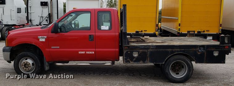 image for item DH2855 2006 Ford F350 Super Duty SuperCab flatbed pickup truck