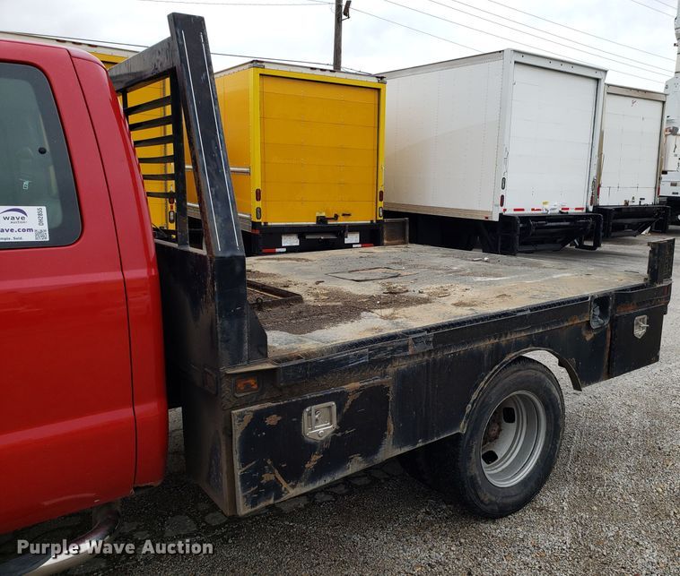 image for item DH2855 2006 Ford F350 Super Duty SuperCab flatbed pickup truck
