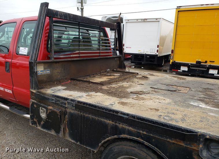 image for item DH2855 2006 Ford F350 Super Duty SuperCab flatbed pickup truck
