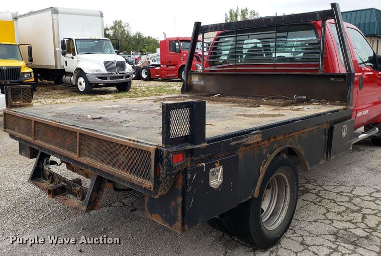image for item DH2855 2006 Ford F350 Super Duty SuperCab flatbed pickup truck