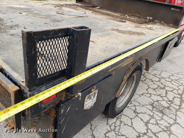 image for item DH2855 2006 Ford F350 Super Duty SuperCab flatbed pickup truck