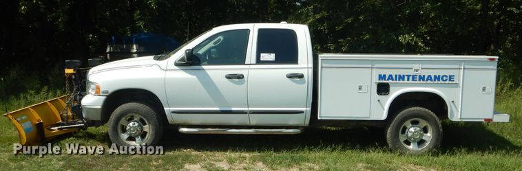 image for item DH6129 2005 Dodge Ram 2500 Quad Cab utility bed pickup truck
