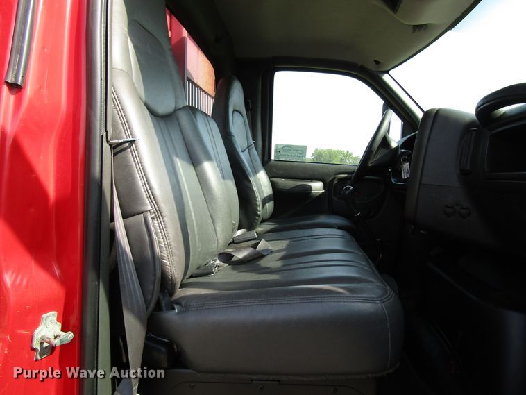 image for item DE2401 2006 GMC C7500 flat dump bed truck