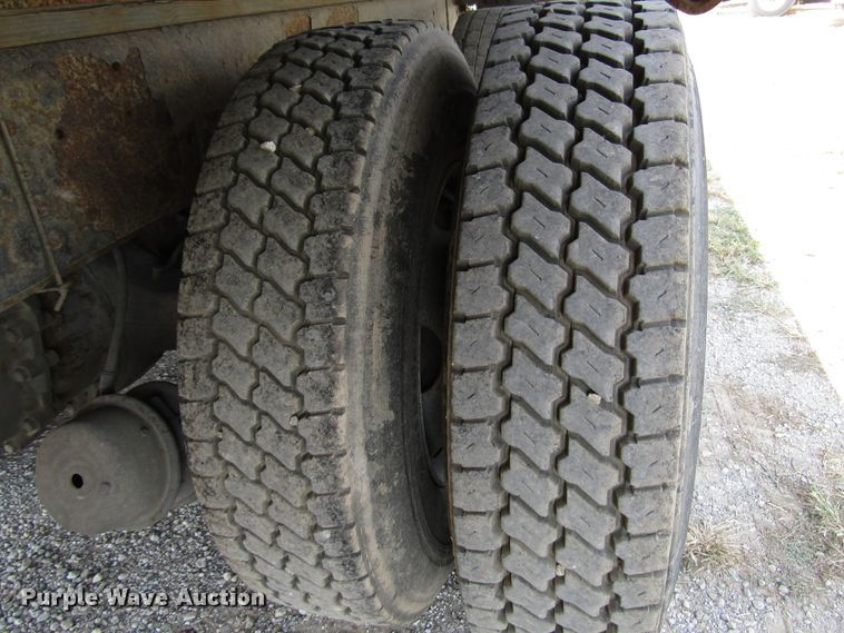 image for item DE2402 2005 GMC C8500 flat dump bed truck