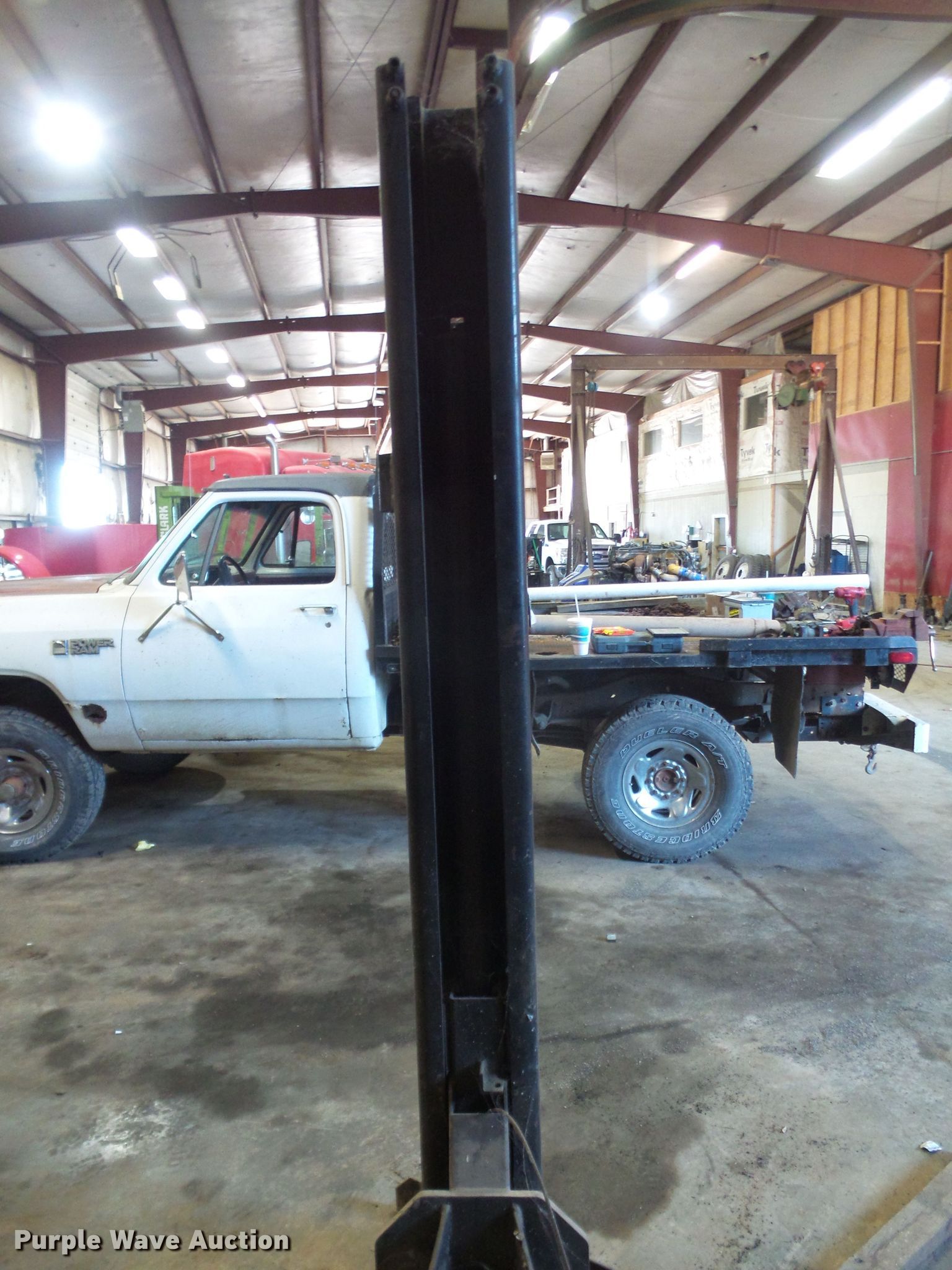 Two post automotive lift in Lebo, KS Item FB9327 sold Purple Wave