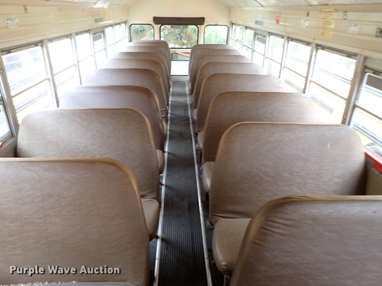 image for item DB7720 1999 Blue Bird TC2000 school bus