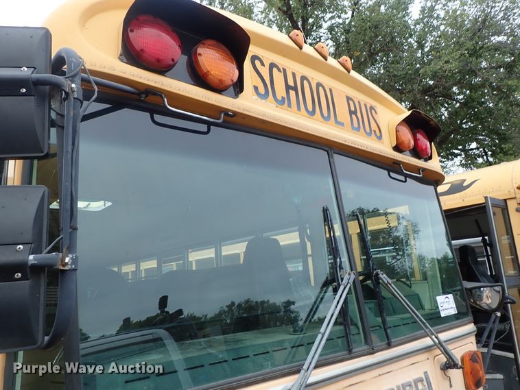 image for item DB7720 1999 Blue Bird TC2000 school bus