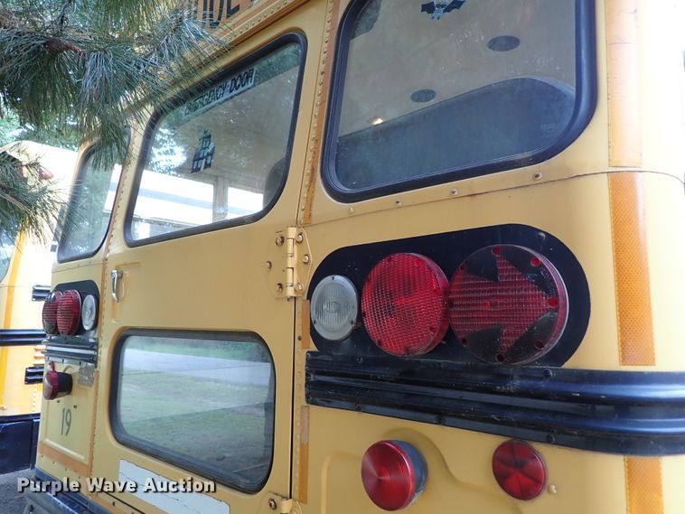 image for item DB7720 1999 Blue Bird TC2000 school bus