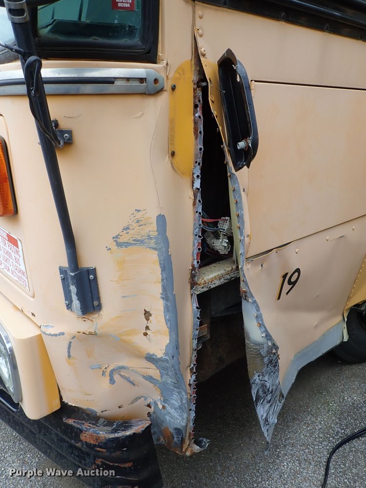 image for item DB7720 1999 Blue Bird TC2000 school bus