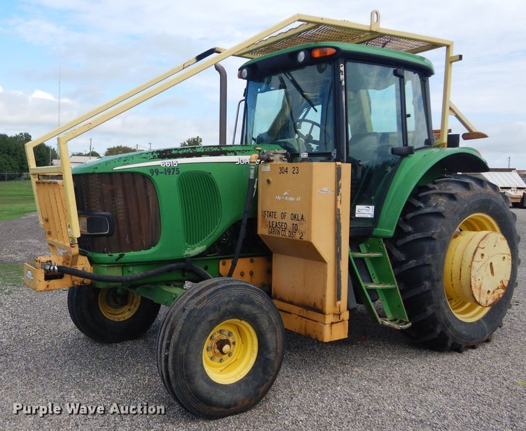 image for item DH3581 2005 John Deere 6615 tractor with Diamond side boom mower