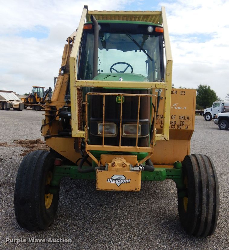 image for item DH3581 2005 John Deere 6615 tractor with Diamond side boom mower