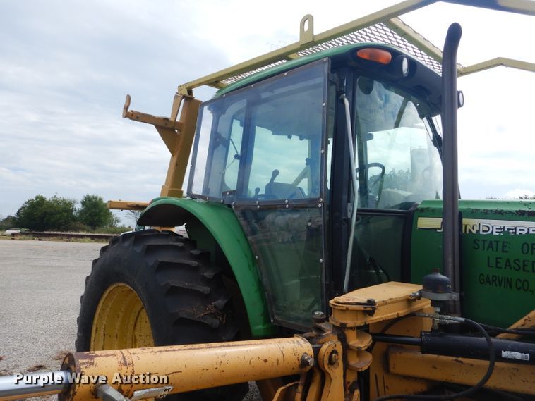 image for item DH3581 2005 John Deere 6615 tractor with Diamond side boom mower