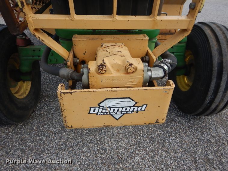 image for item DH3581 2005 John Deere 6615 tractor with Diamond side boom mower