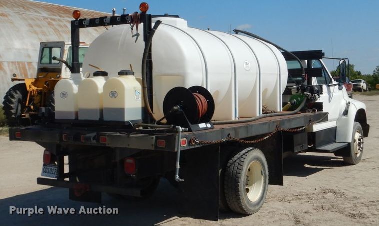 image for item FU9545 1997 Ford F700 flatbed truck with sprayer system