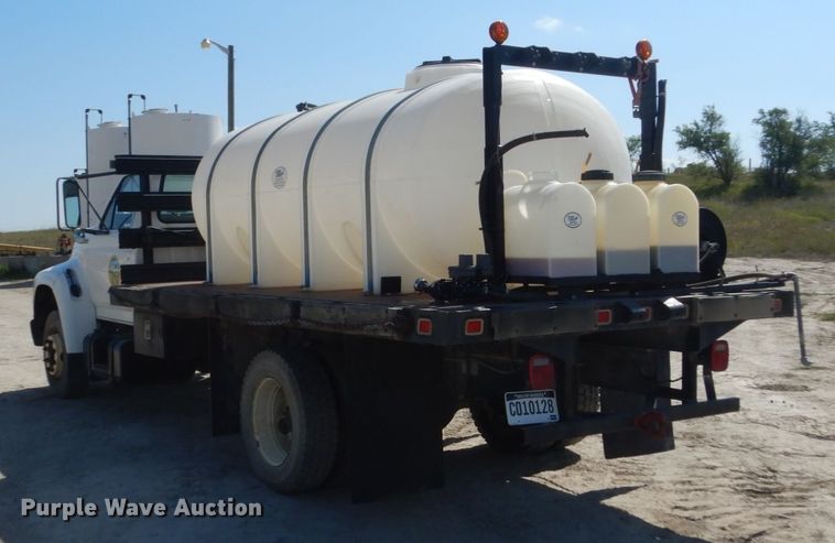 image for item FU9545 1997 Ford F700 flatbed truck with sprayer system