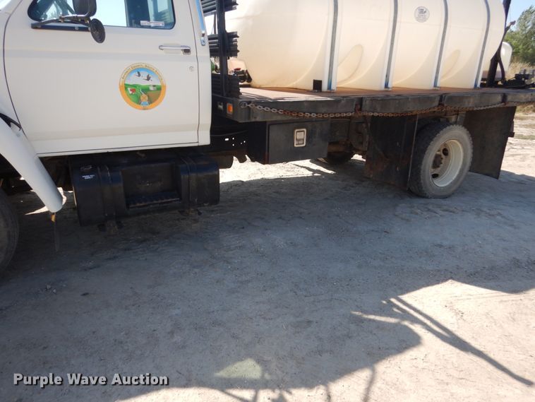 image for item FU9545 1997 Ford F700 flatbed truck with sprayer system