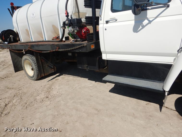 image for item FU9545 1997 Ford F700 flatbed truck with sprayer system