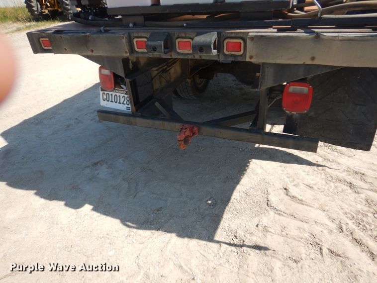 image for item FU9545 1997 Ford F700 flatbed truck with sprayer system