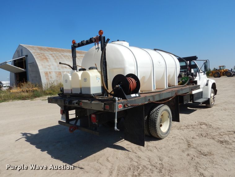 image for item FU9545 1997 Ford F700 flatbed truck with sprayer system