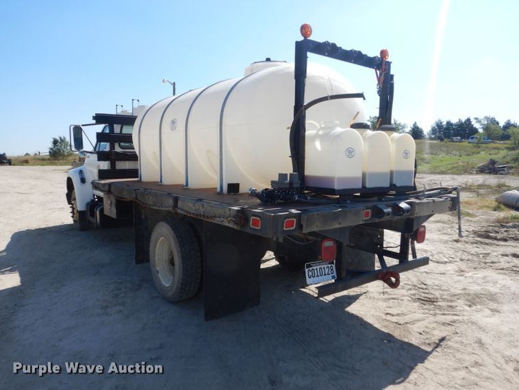 image for item FU9545 1997 Ford F700 flatbed truck with sprayer system