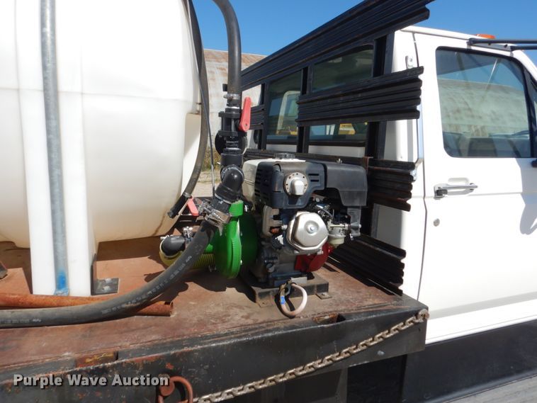 image for item FU9545 1997 Ford F700 flatbed truck with sprayer system