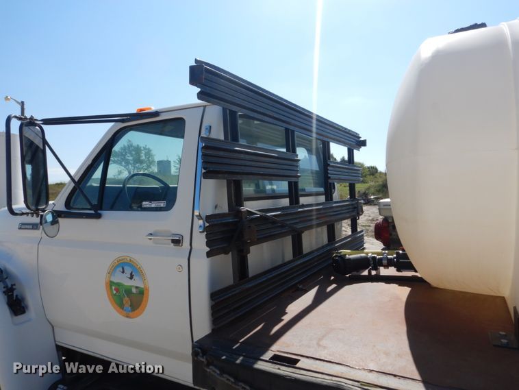 image for item FU9545 1997 Ford F700 flatbed truck with sprayer system