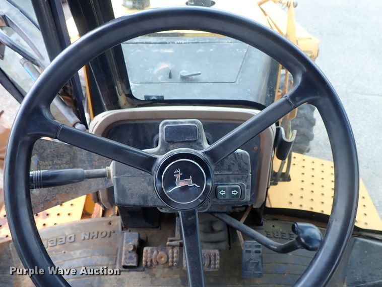 image for item DE1084 1999 John Deere 310E backhoe