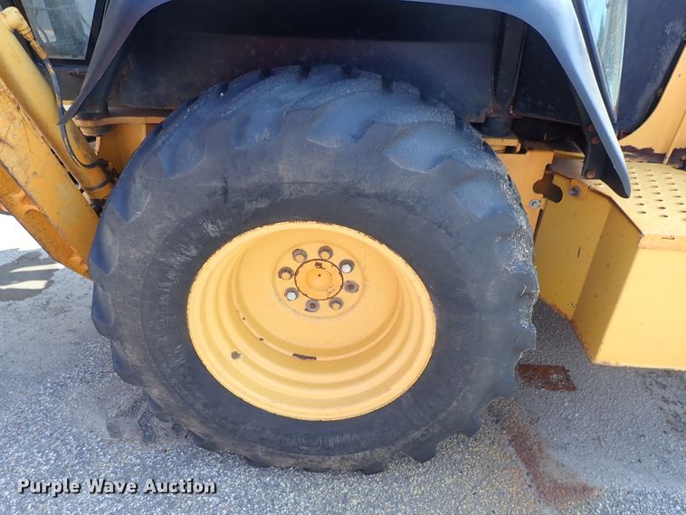 image for item DE1084 1999 John Deere 310E backhoe