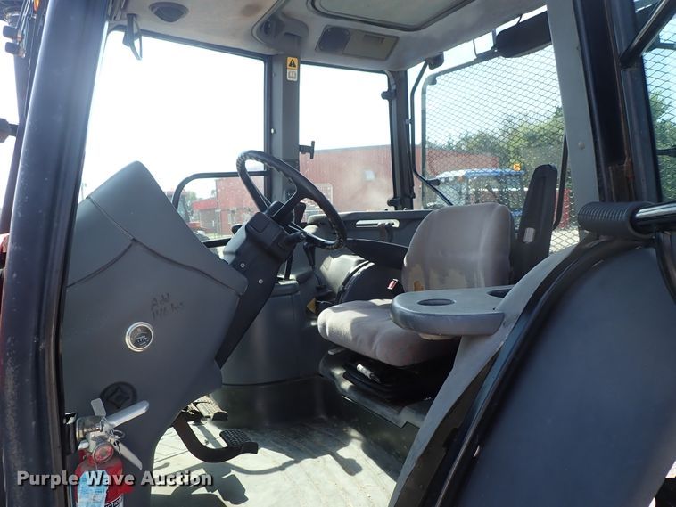 image for item DE1087 1999 New Holland TS100 tractor