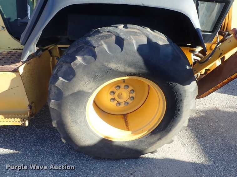 image for item DE1092 1998 John Deere 310E backhoe