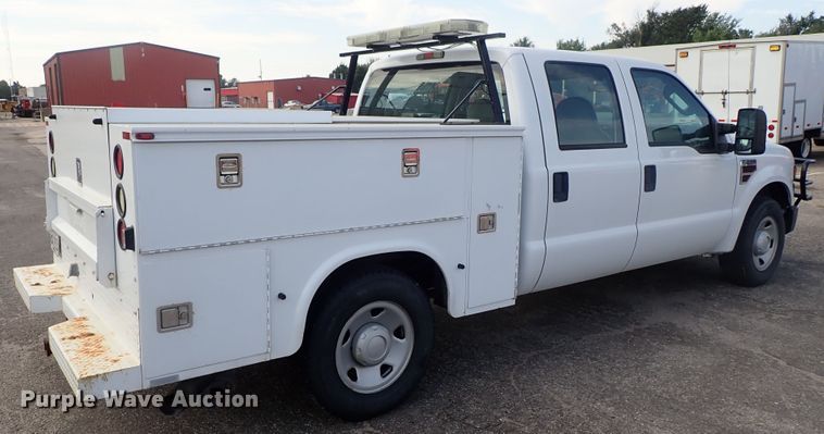 image for item DE1093 2008 Ford F250 Super Duty Crew Cab utility bed pickup truck