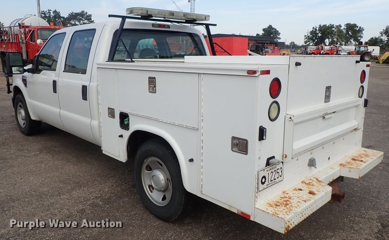 image for item DE1093 2008 Ford F250 Super Duty Crew Cab utility bed pickup truck