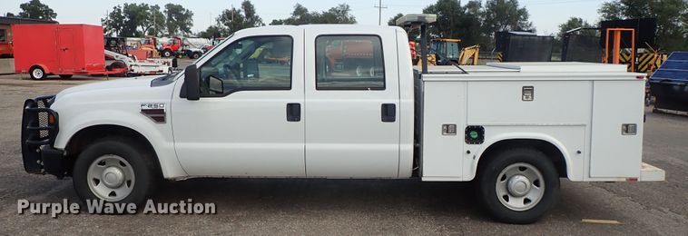 image for item DE1093 2008 Ford F250 Super Duty Crew Cab utility bed pickup truck