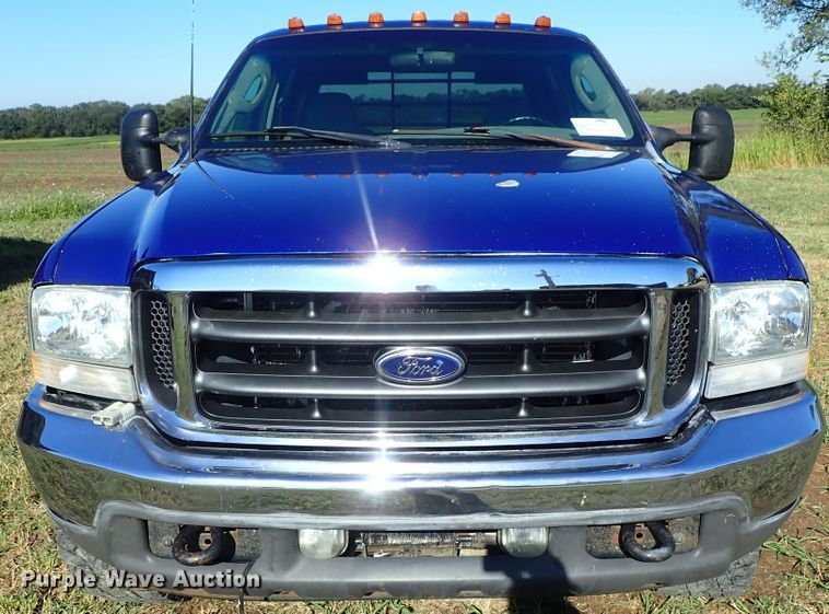 image for item DB7700 2003 Ford F250 Super Duty Crew Cab flatbed pickup truck