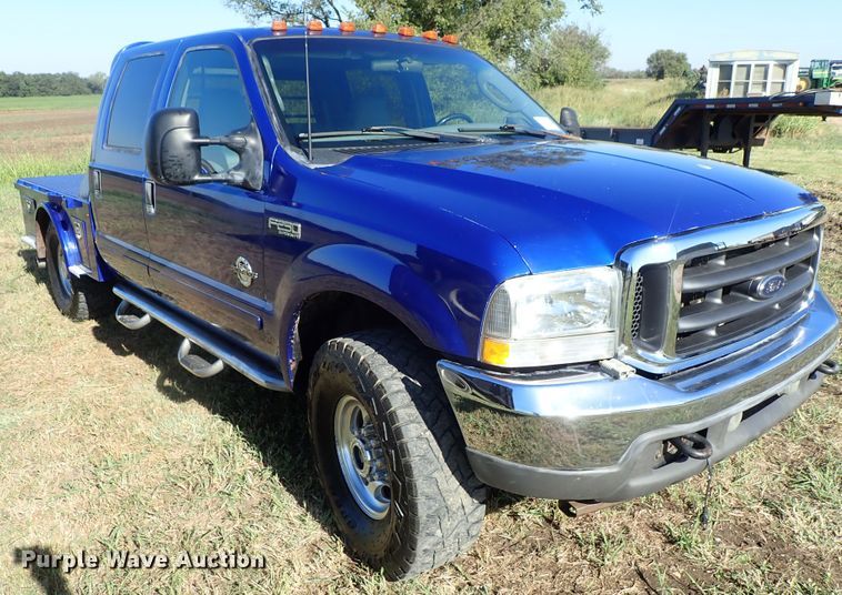 image for item DB7700 2003 Ford F250 Super Duty Crew Cab flatbed pickup truck