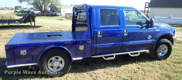 image for item DB7700 2003 Ford F250 Super Duty Crew Cab flatbed pickup truck