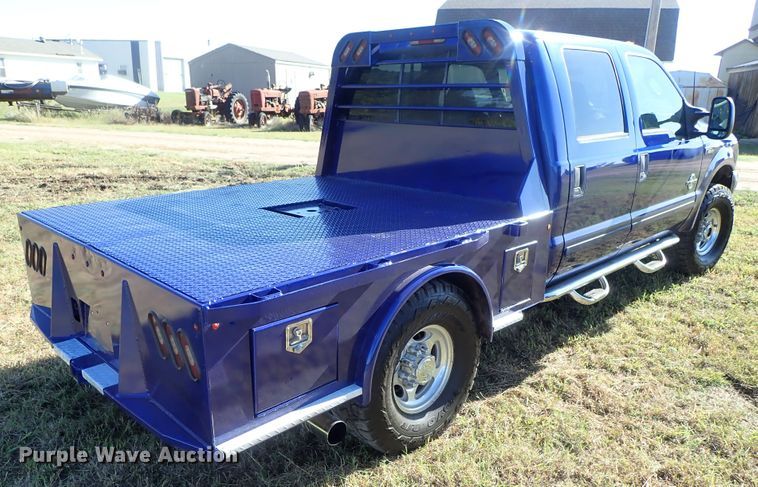 image for item DB7700 2003 Ford F250 Super Duty Crew Cab flatbed pickup truck