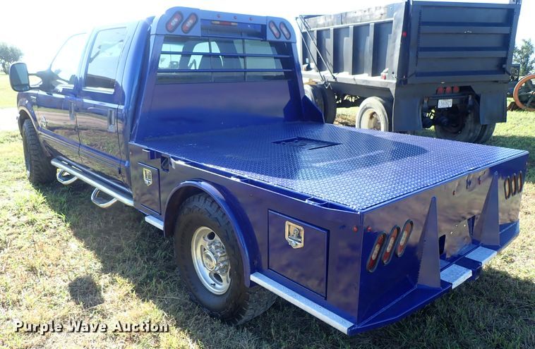 image for item DB7700 2003 Ford F250 Super Duty Crew Cab flatbed pickup truck