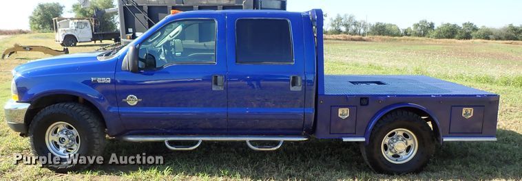 image for item DB7700 2003 Ford F250 Super Duty Crew Cab flatbed pickup truck