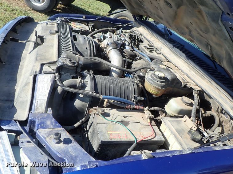 image for item DB7700 2003 Ford F250 Super Duty Crew Cab flatbed pickup truck