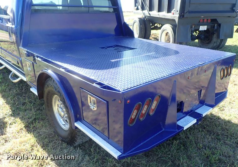 image for item DB7700 2003 Ford F250 Super Duty Crew Cab flatbed pickup truck