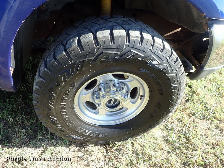 image for item DB7700 2003 Ford F250 Super Duty Crew Cab flatbed pickup truck